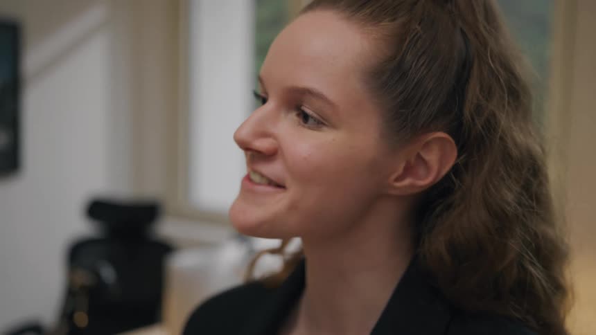 Woman standing indoors talking