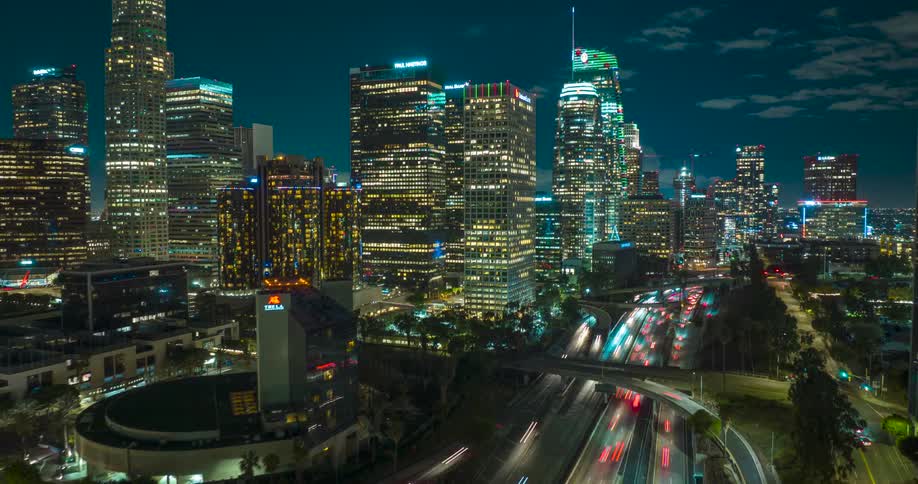 Aerial of a busy lit Los Angeles skyline at night
