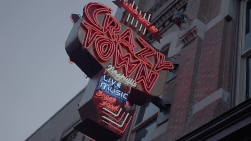 Close up of a neon sign outside of a bar