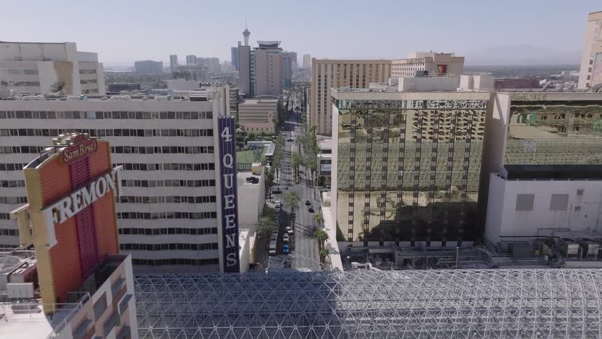 Panoramic view of buildings in downtown Las Vegas against a blue sky