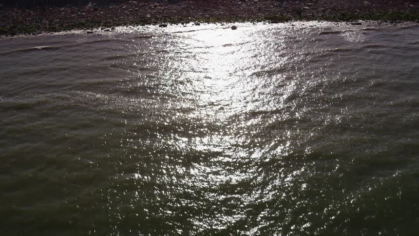 Sunlight shining on a large body of water
