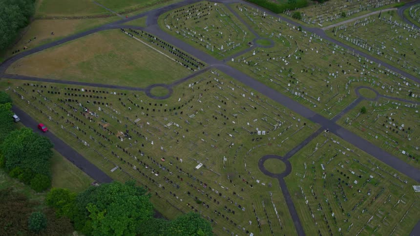 A cemetery near a wooded area