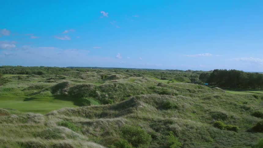 Rolling hills strewn across an open landscape