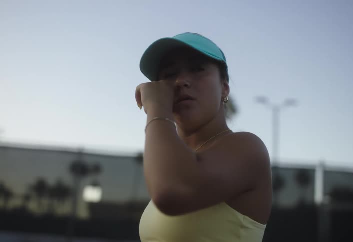 A tennis player is crying on the court