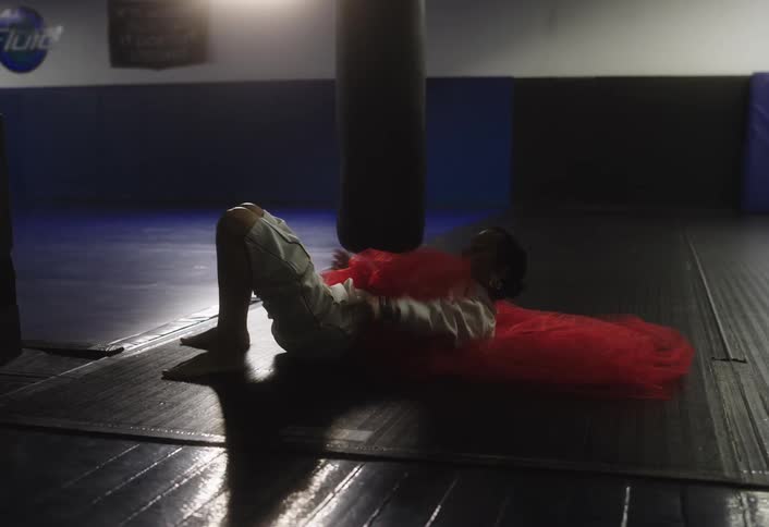 A woman is stretching on the floor