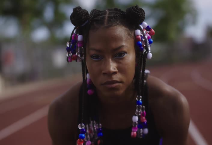 A woman is preparing to run on the track