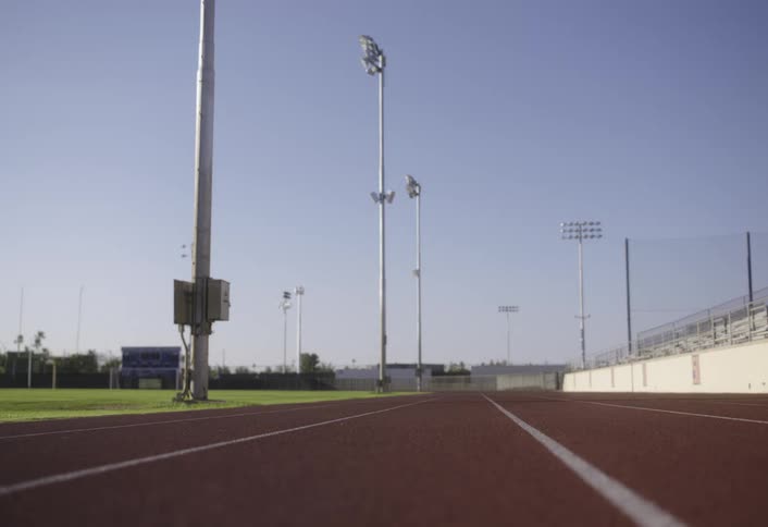 Running track next to a grass field