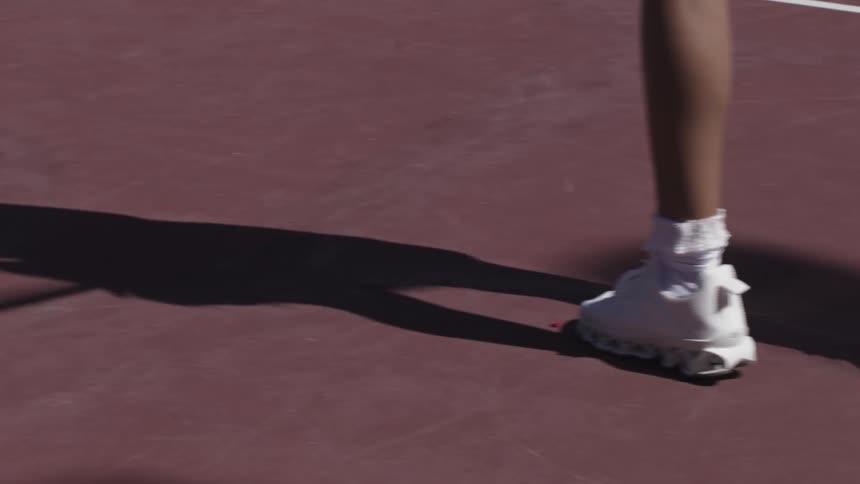 A woman swings a tennis racket