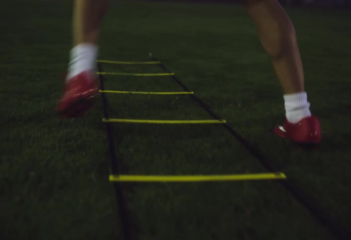 A woman is running on the green grass
