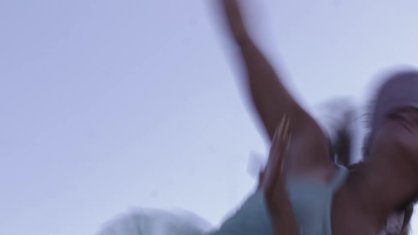 Close up of a woman playing tennis outdoors during daytime