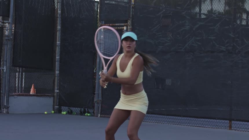 Woman on a court playing tennis