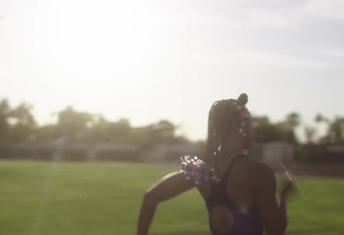 The woman races around the track