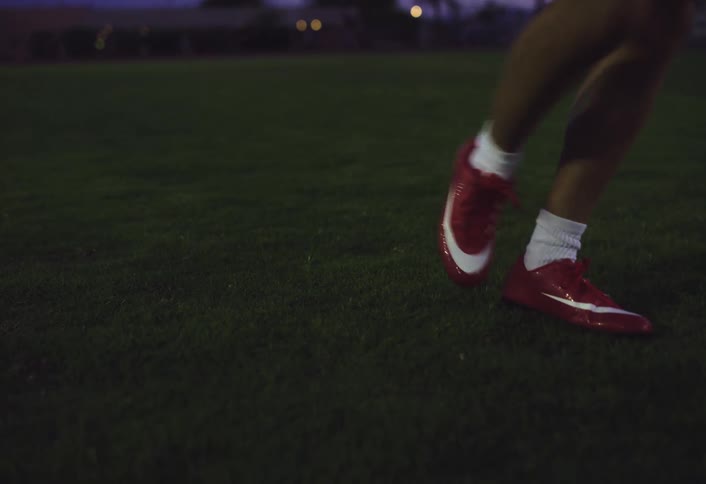 A athlete moves through an exercise on the field