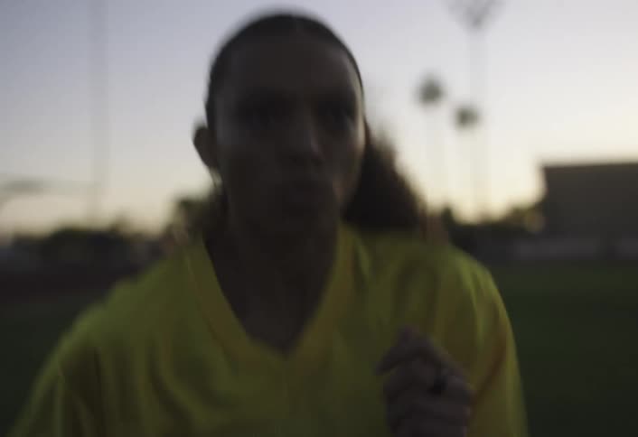 A girl is running in place on the field