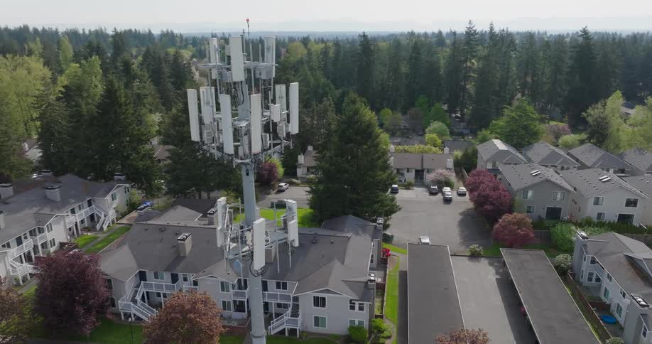 A cell tower provides wireless data and mobile broadband to residents of a suburban neighborhood