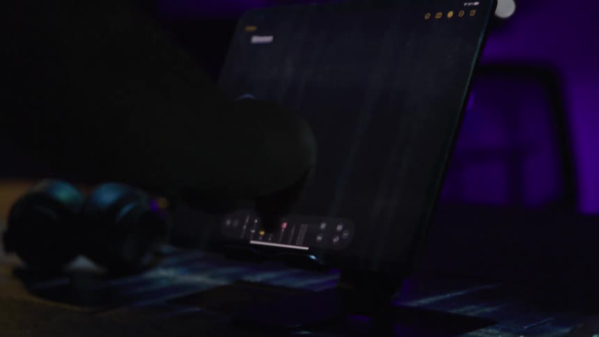 A person draws lines on the tablet