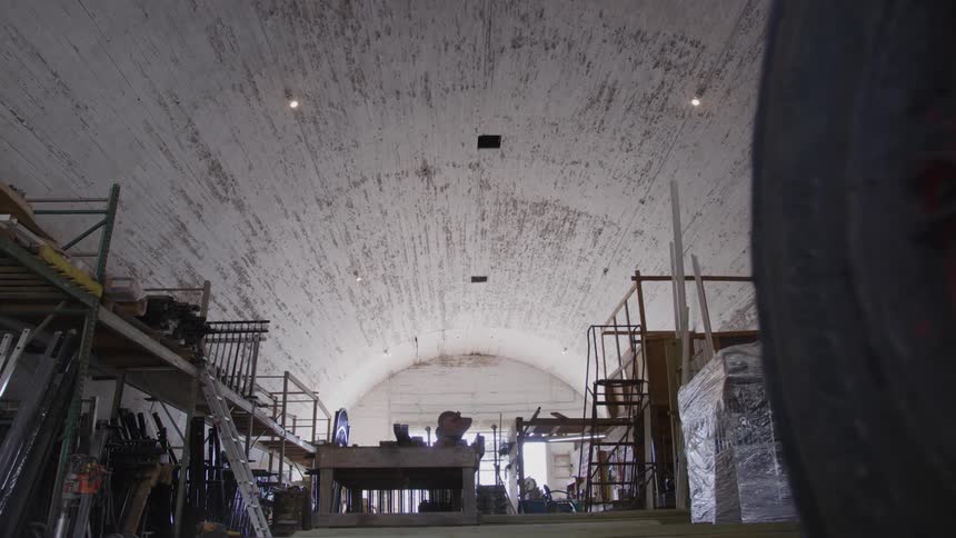 The inside of a large building with a rounded roof