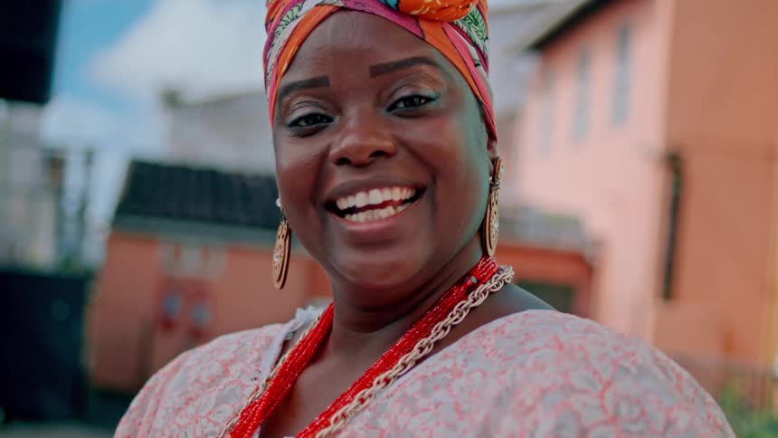 A woman smiles and laughs
