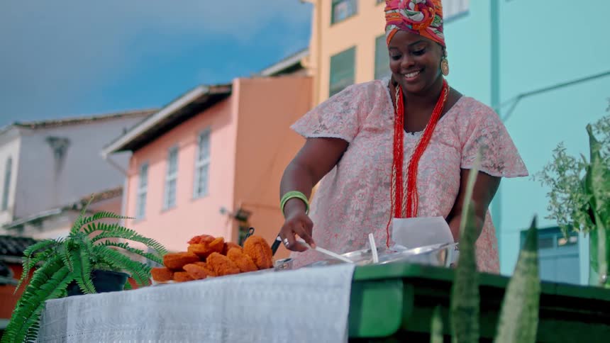 A woman makes samples of food