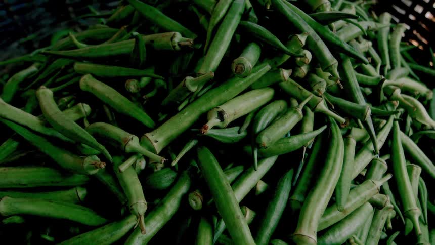 A stack of okra are at the market