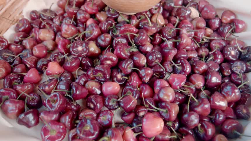 A large pile of cherries