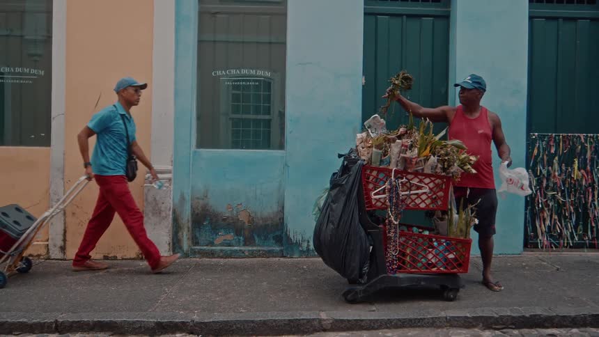 A street vendor goes about his daily work on the street