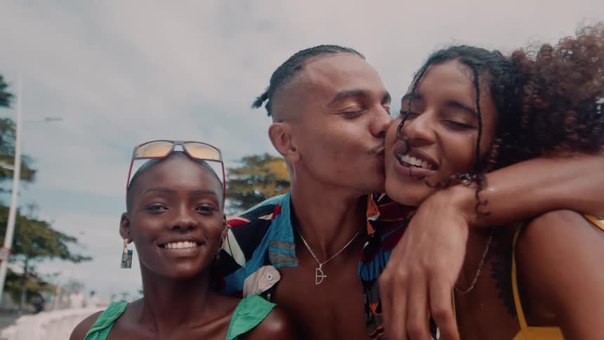 Friends laugh and have fun on the beach