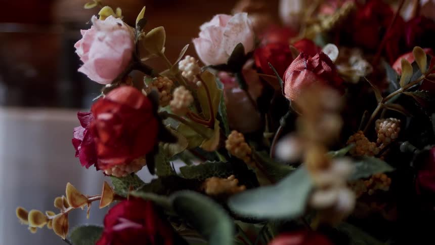 A fake bouquet of flowers is in the room