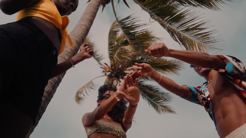 Friends dance together on a windy day