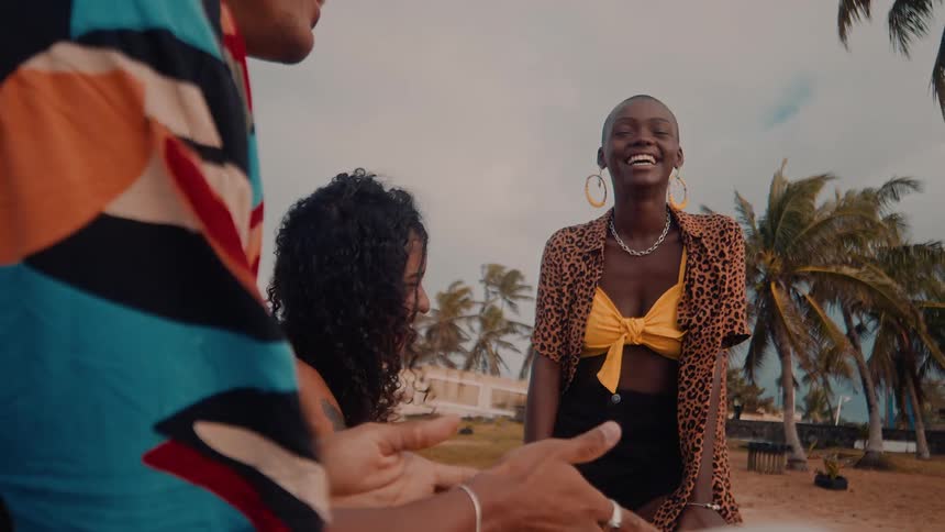 Friends enjoy a fun moment together on a tropical beach