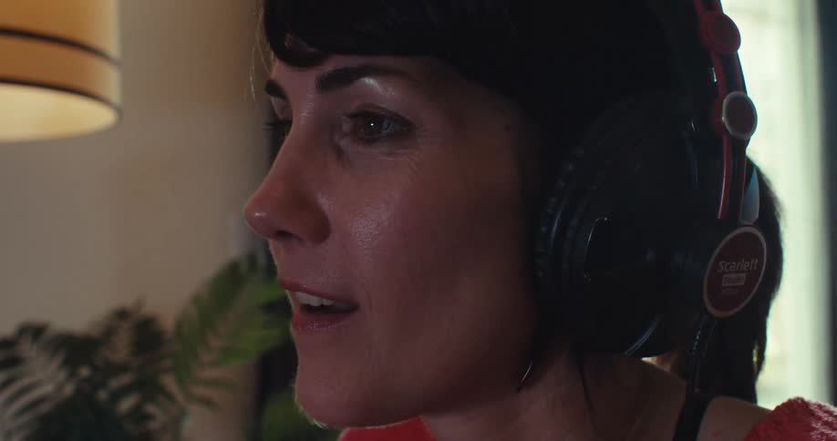 A woman plays a video game