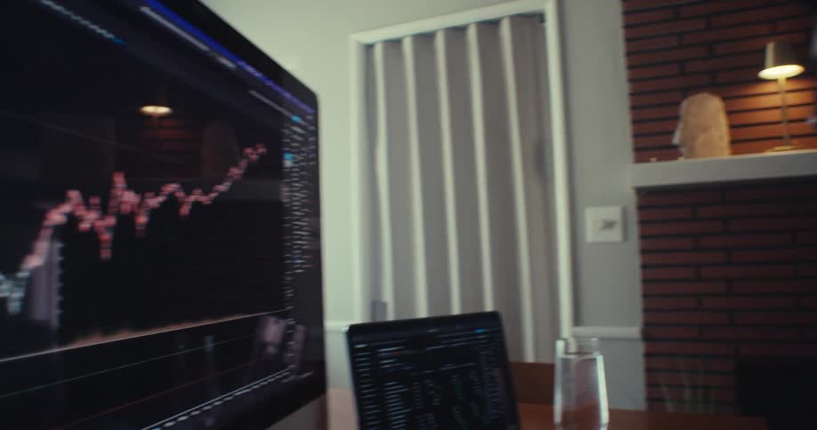 A man is reading the line graph on the monitor