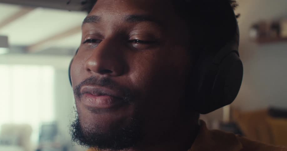 A man happily takes a business call