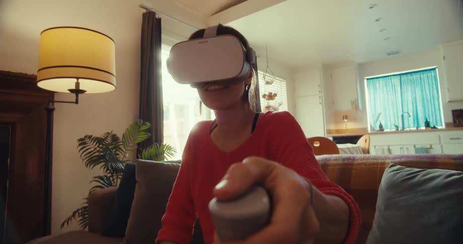 Woman having fun using virtual reality glasses