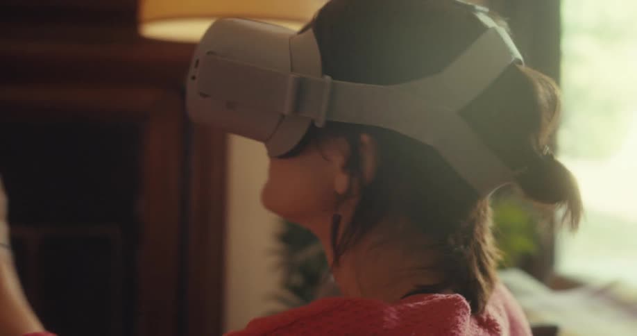 Woman sitting using virtual reality glasses