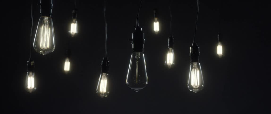 Lightbulbs hang from the ceiling and turn on and off
