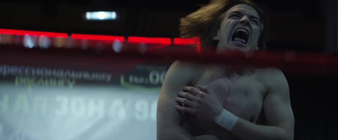 A wrestler yells as he is hit in the ring