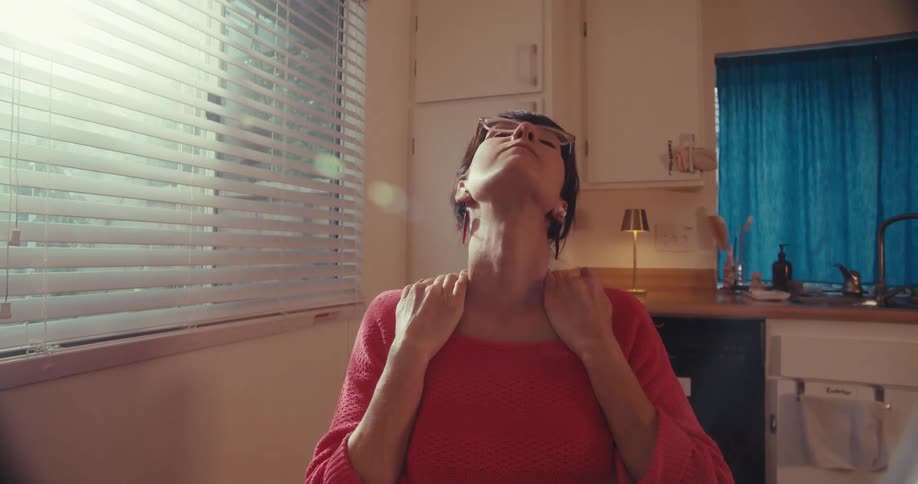 The woman works and stretches at home
