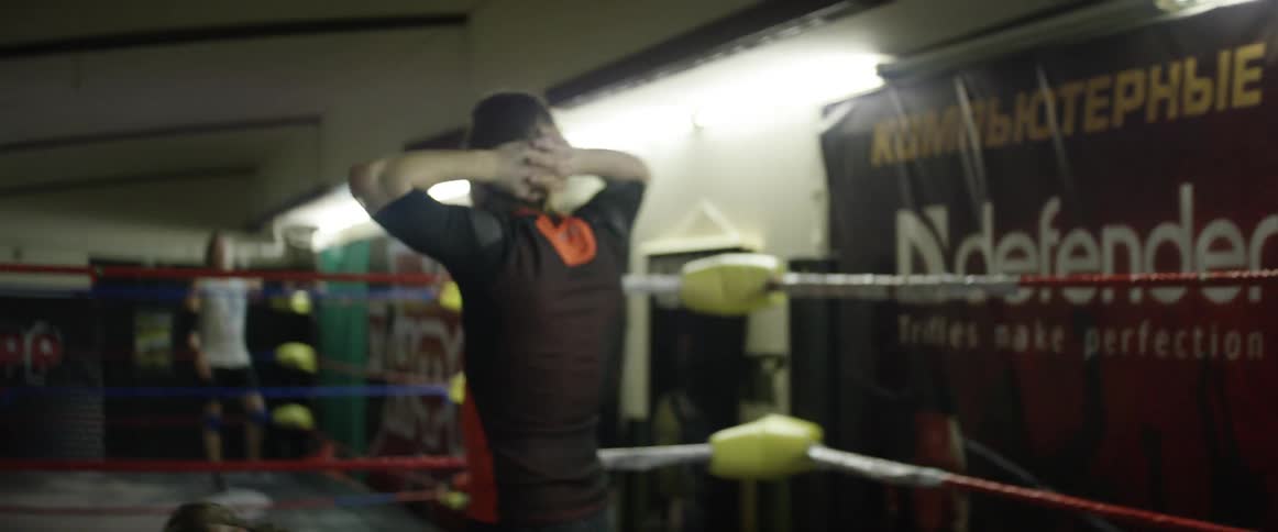 A wrestler walks around a ring