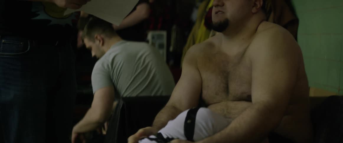 People are dressing in a locker room
