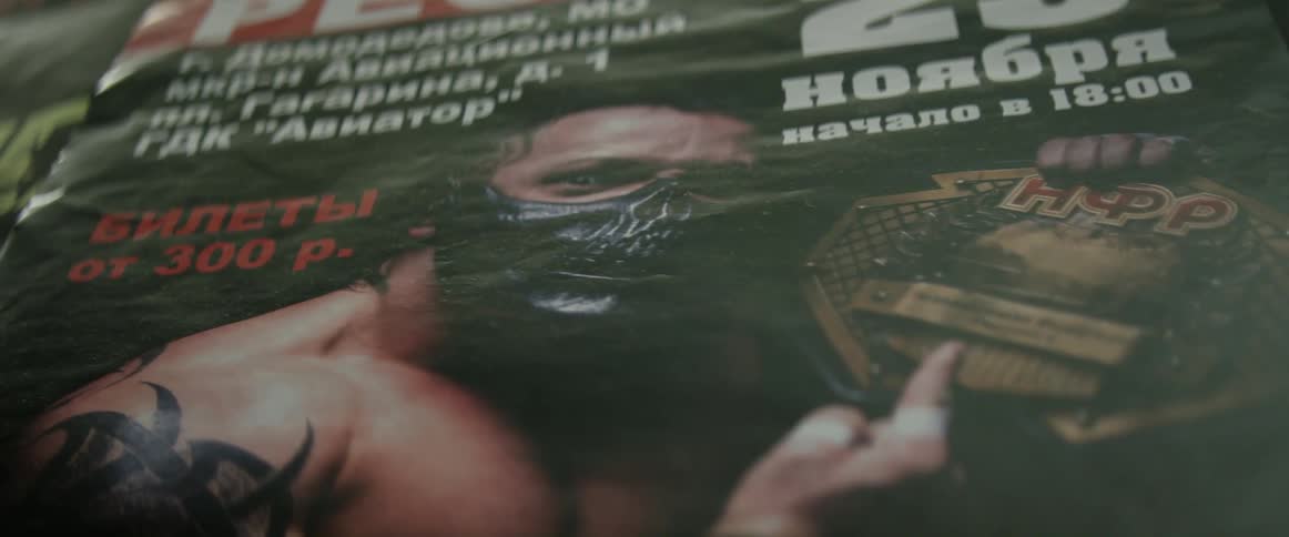 A masked wrestler is featured on the cover of a magazine
