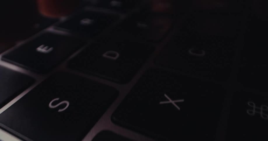 A person types on a keyboard