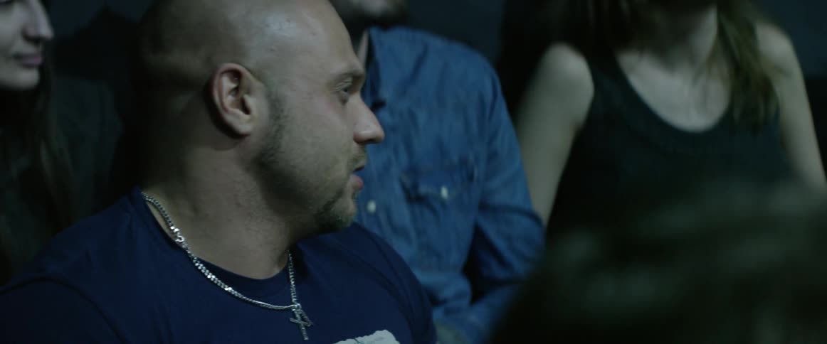 Audience members look on at an event