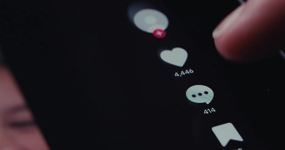 A finger taps the icon of a phone