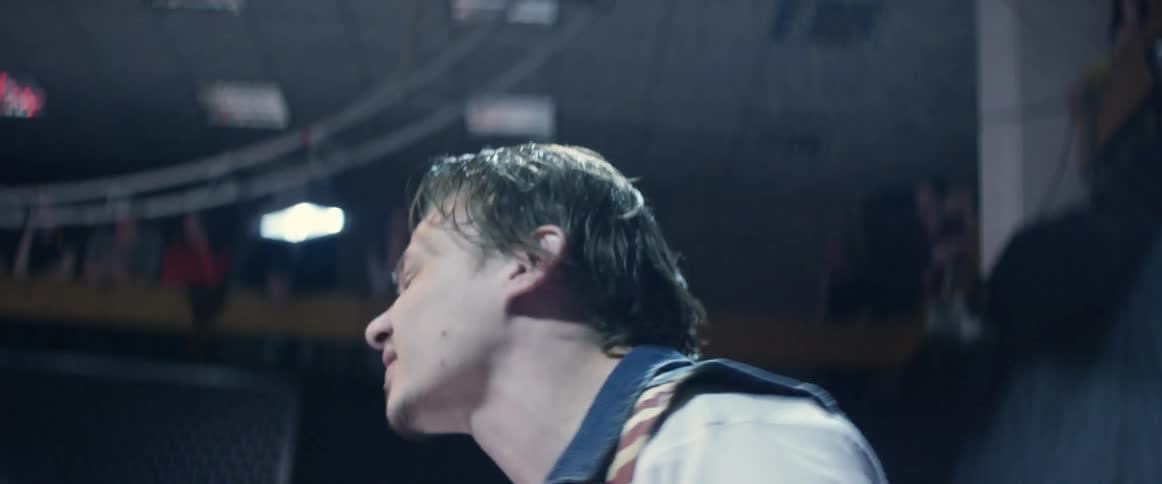 Man yelling and hitting the ropes in a wrestling ring