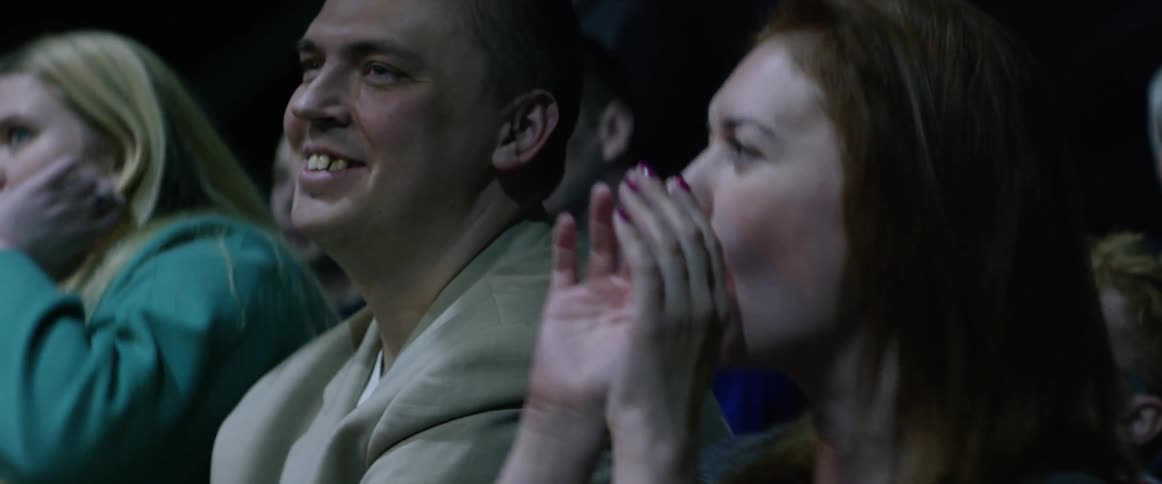 An audience looks on at an event