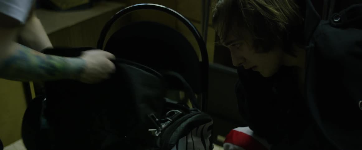 A man packs up a duffle bag