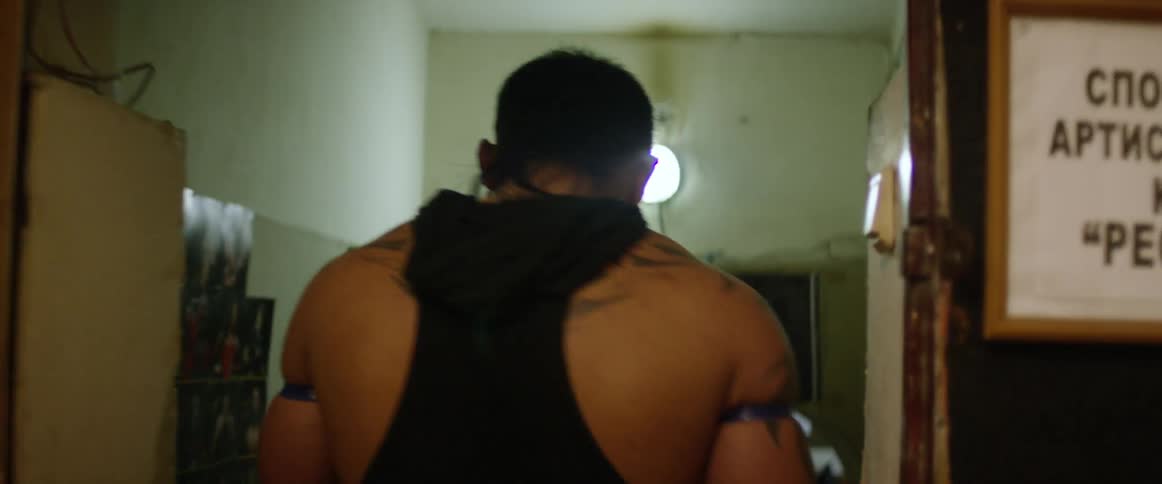 A man walks down a hall