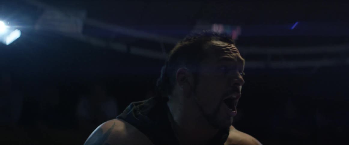 A man shouting and looking around in a ring