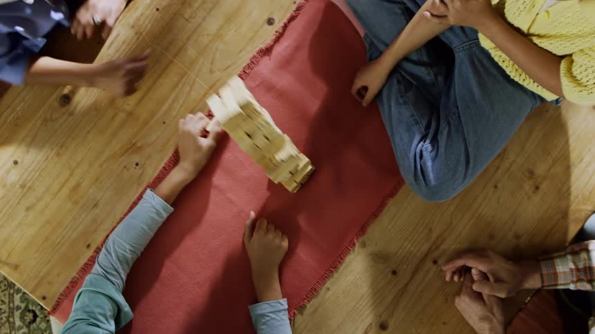 People are playing a game and the blocks fall